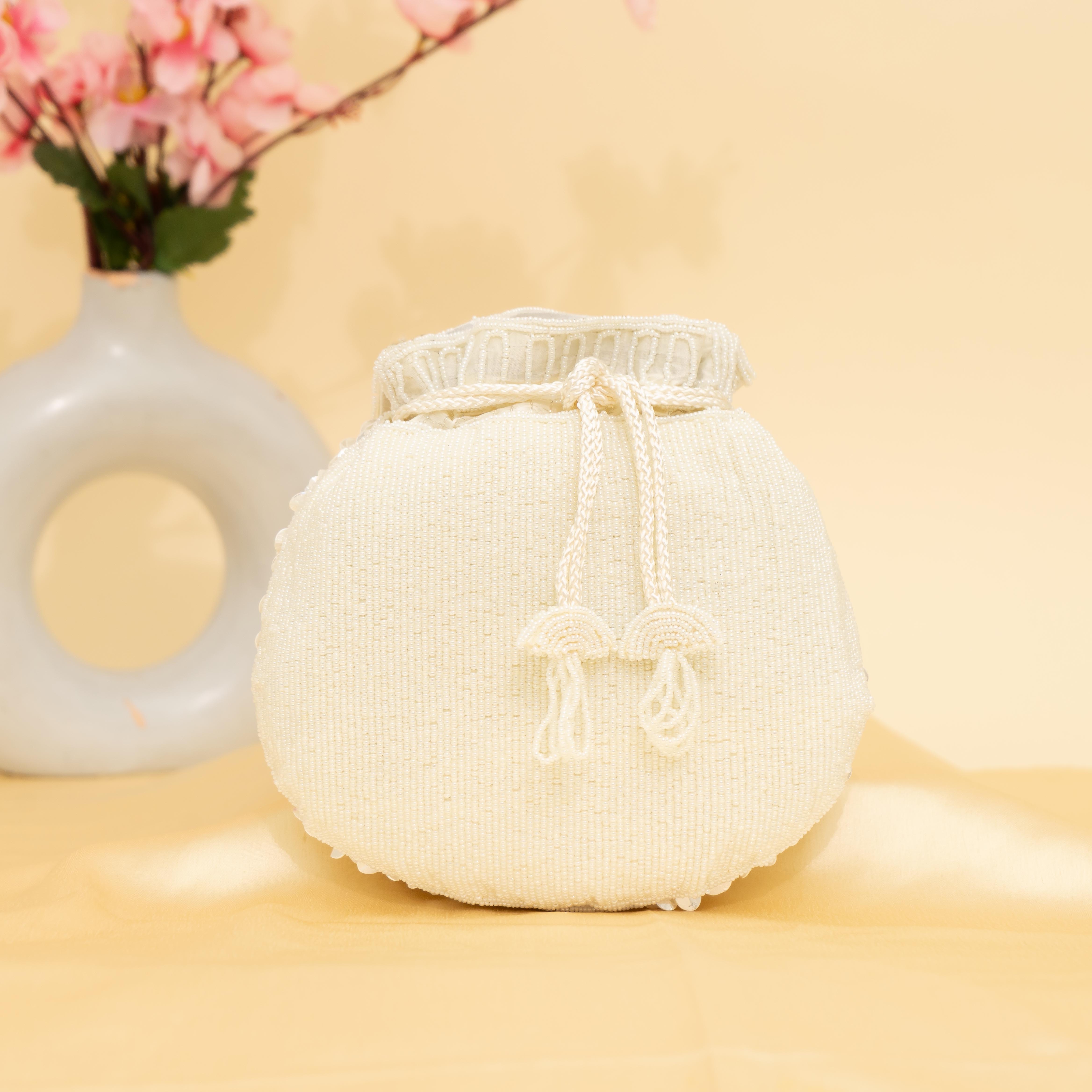 white Celestial Oyster potli | cara