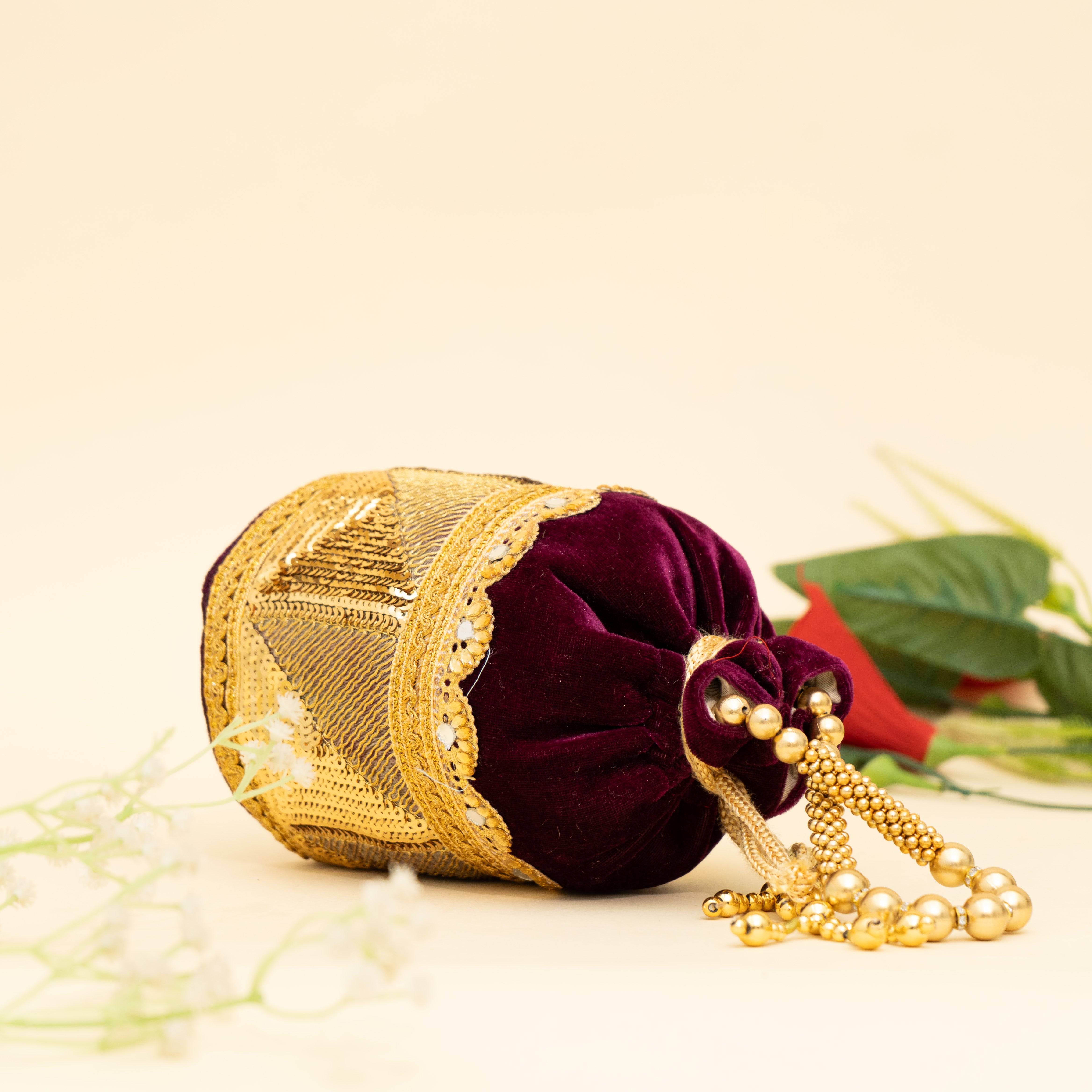 Wine Golden Gleam potli | cara
