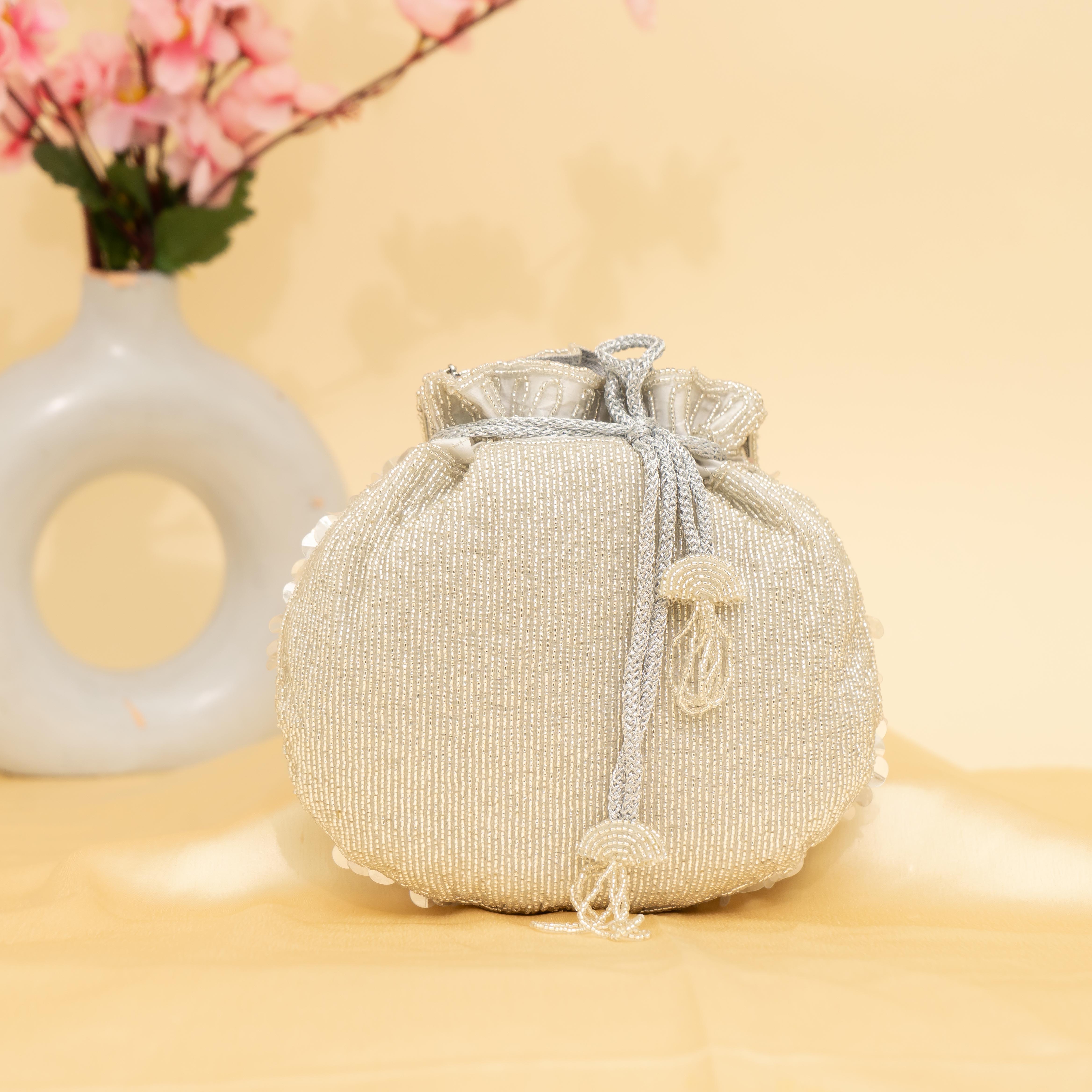 silver Celestial Oyster potli | cara