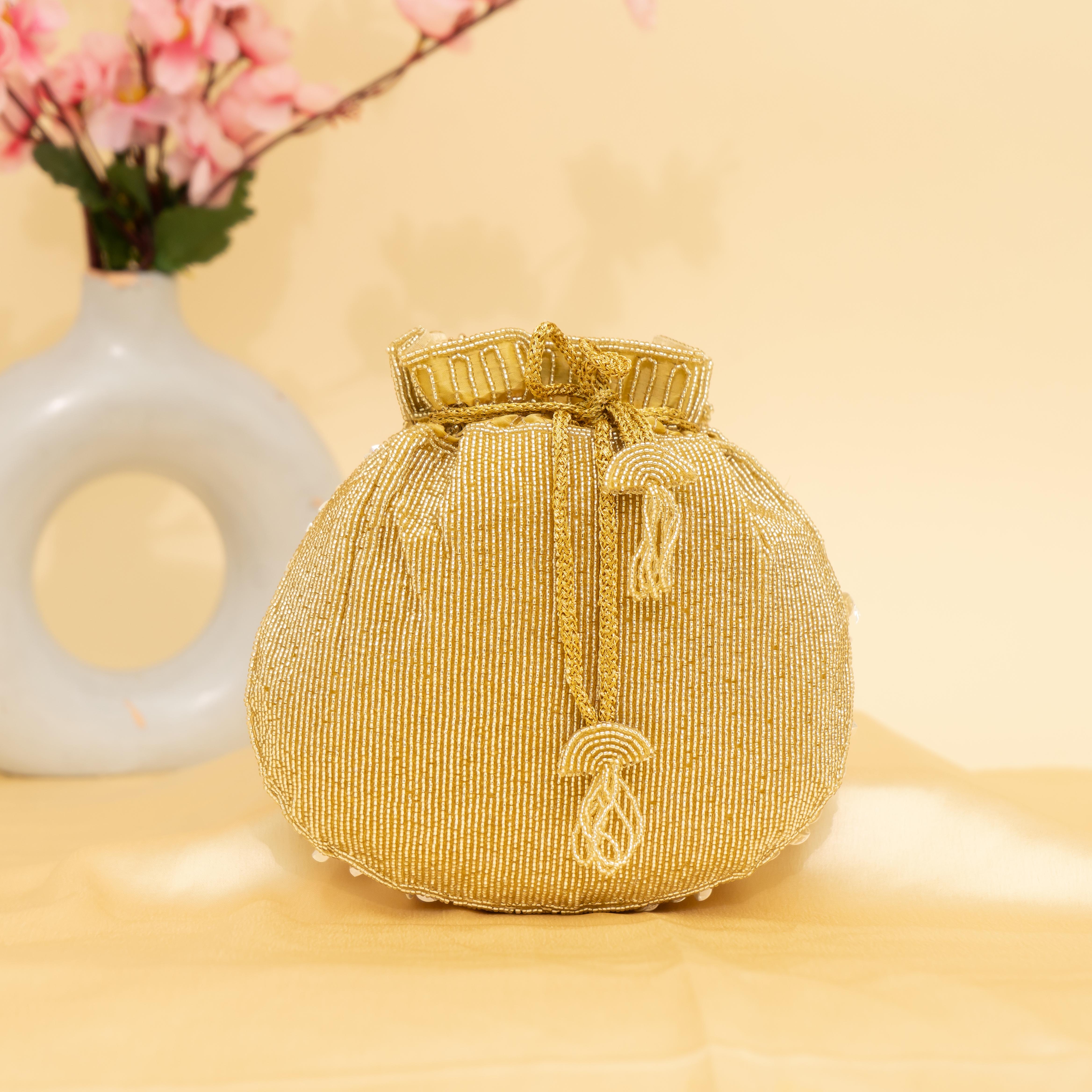 gold Celestial Oyster potli | cara