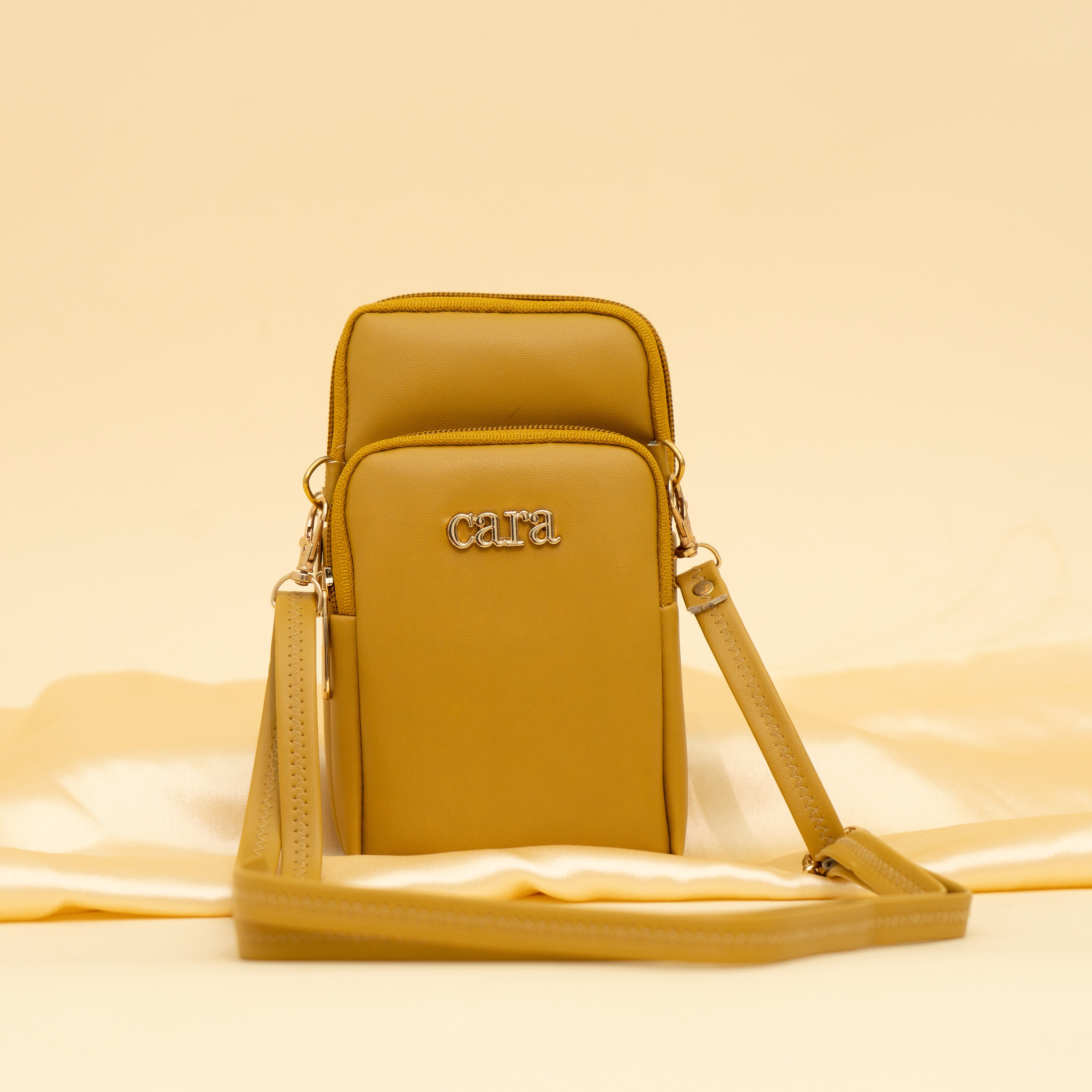yellow Daily Drip mobile sling| cara