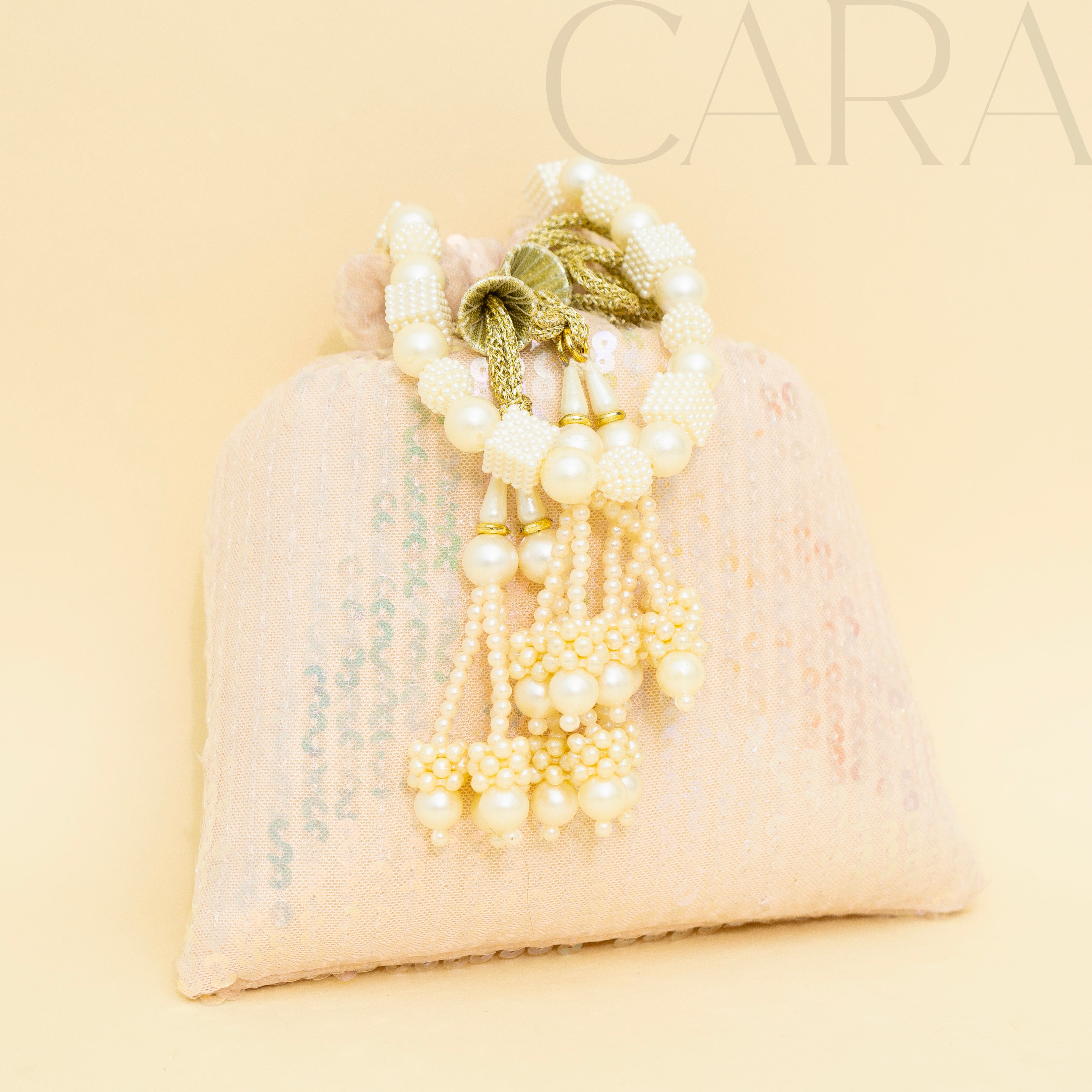 Sequence Peach Potli | Cara