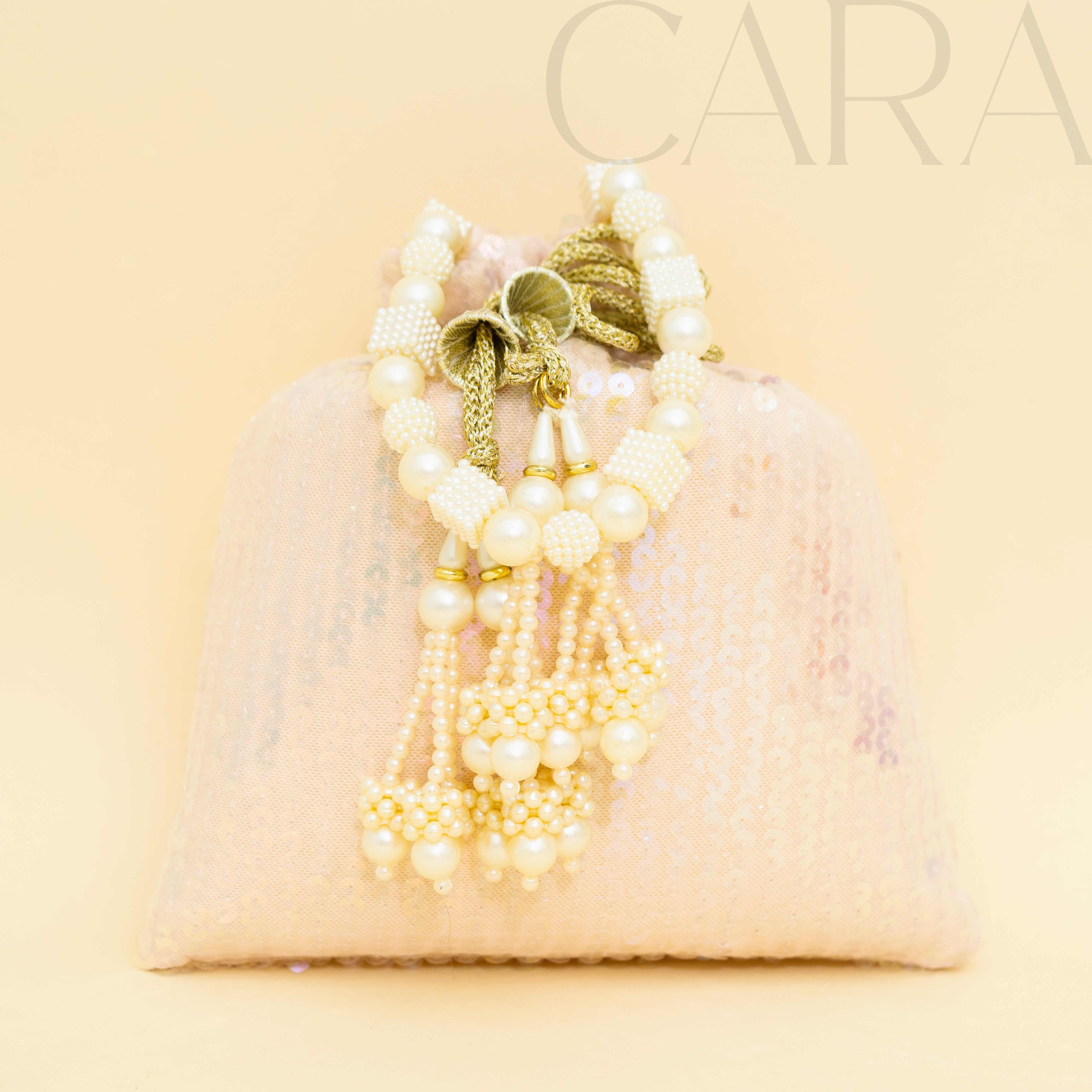 Sequence Peach Potli | Cara