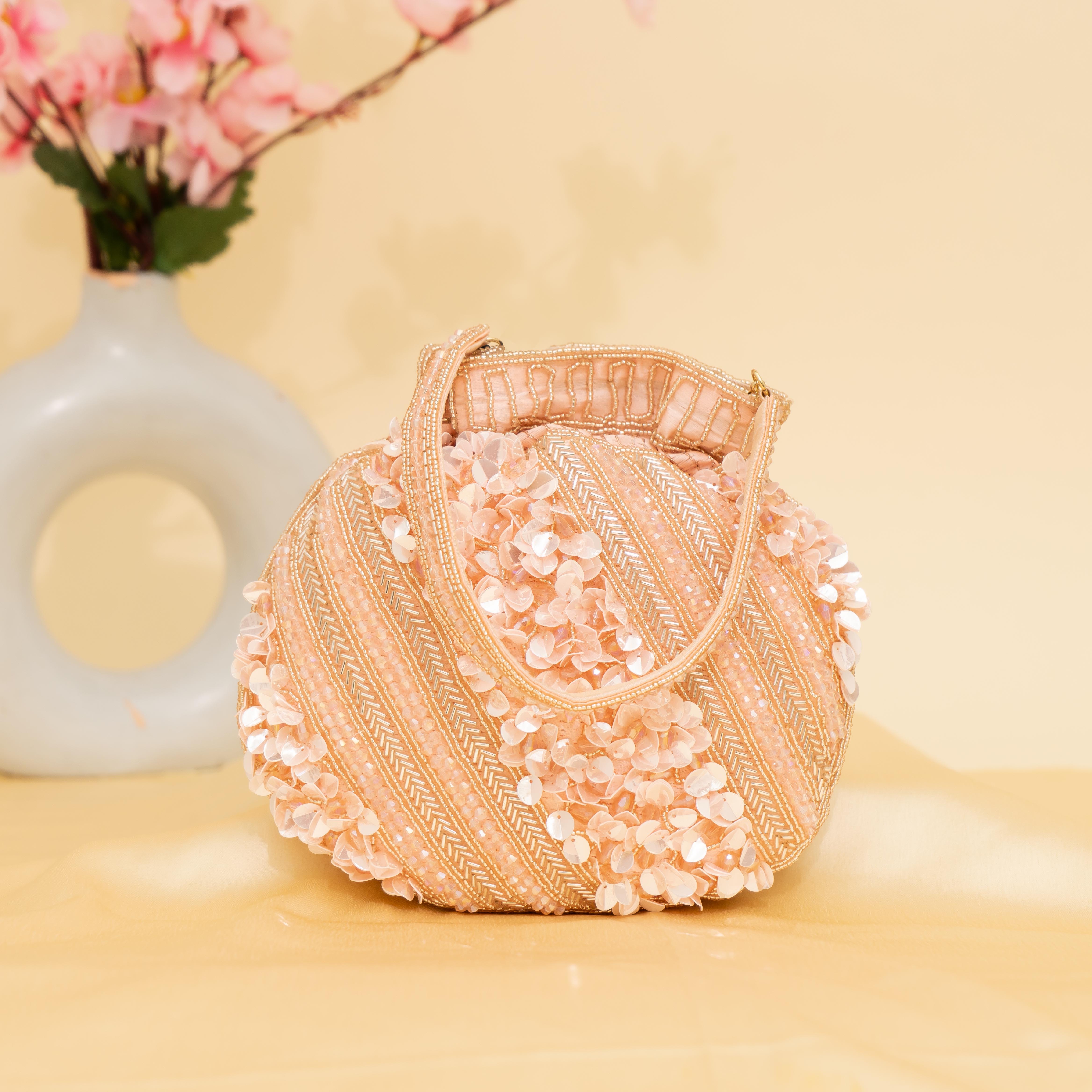 peach Celestial Oyster potli | cara