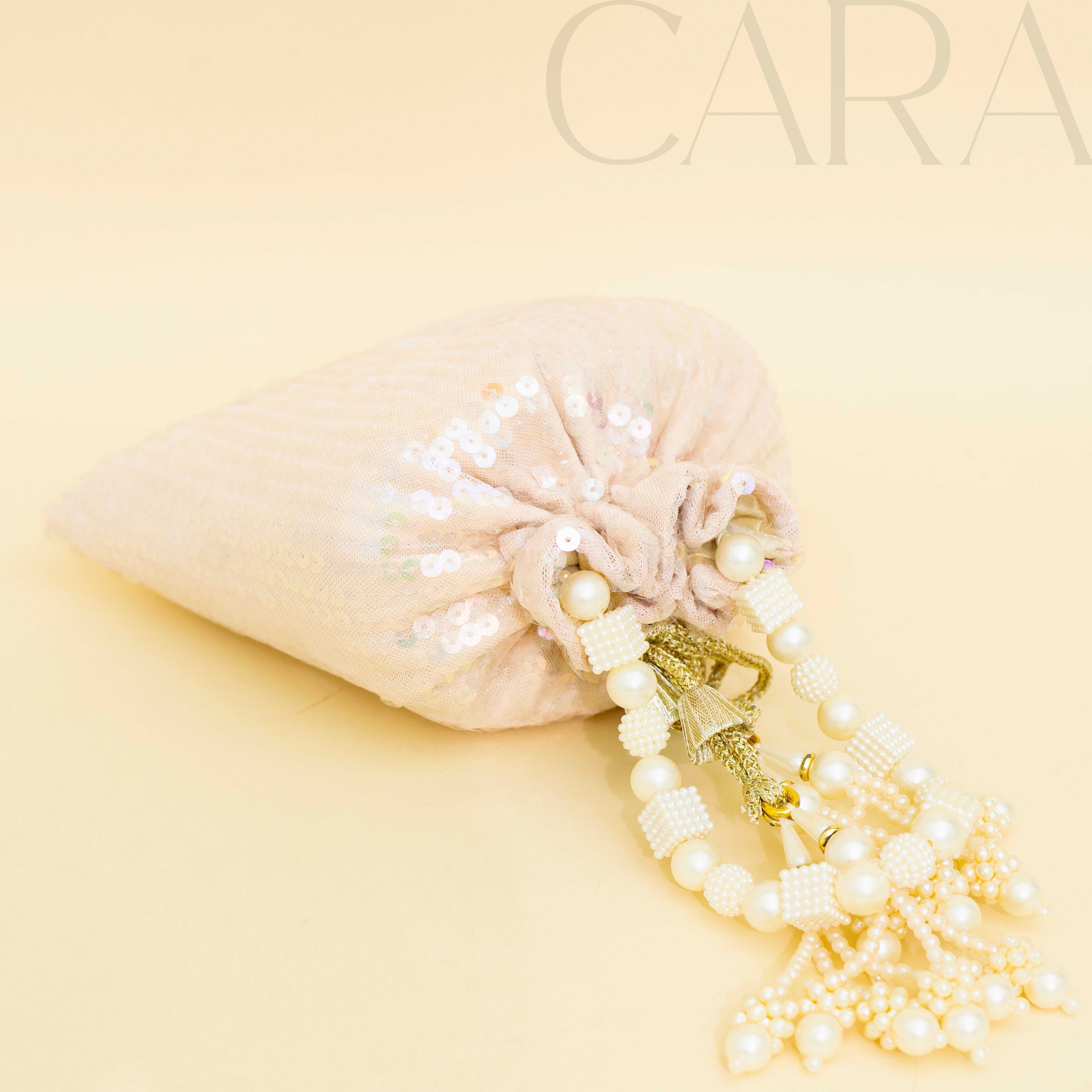 Sequence Peach Potli | Cara