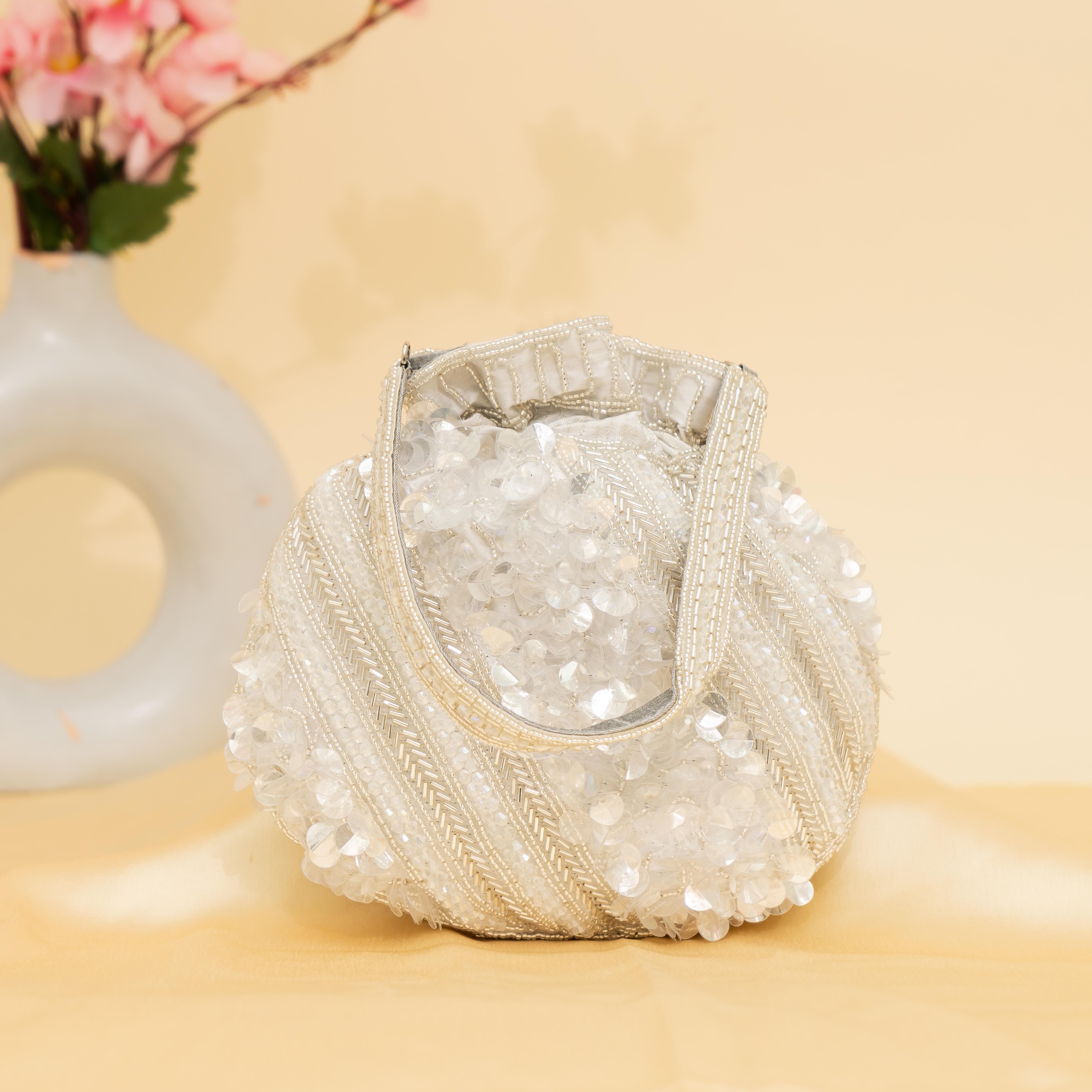 silver Celestial Oyster potli | cara