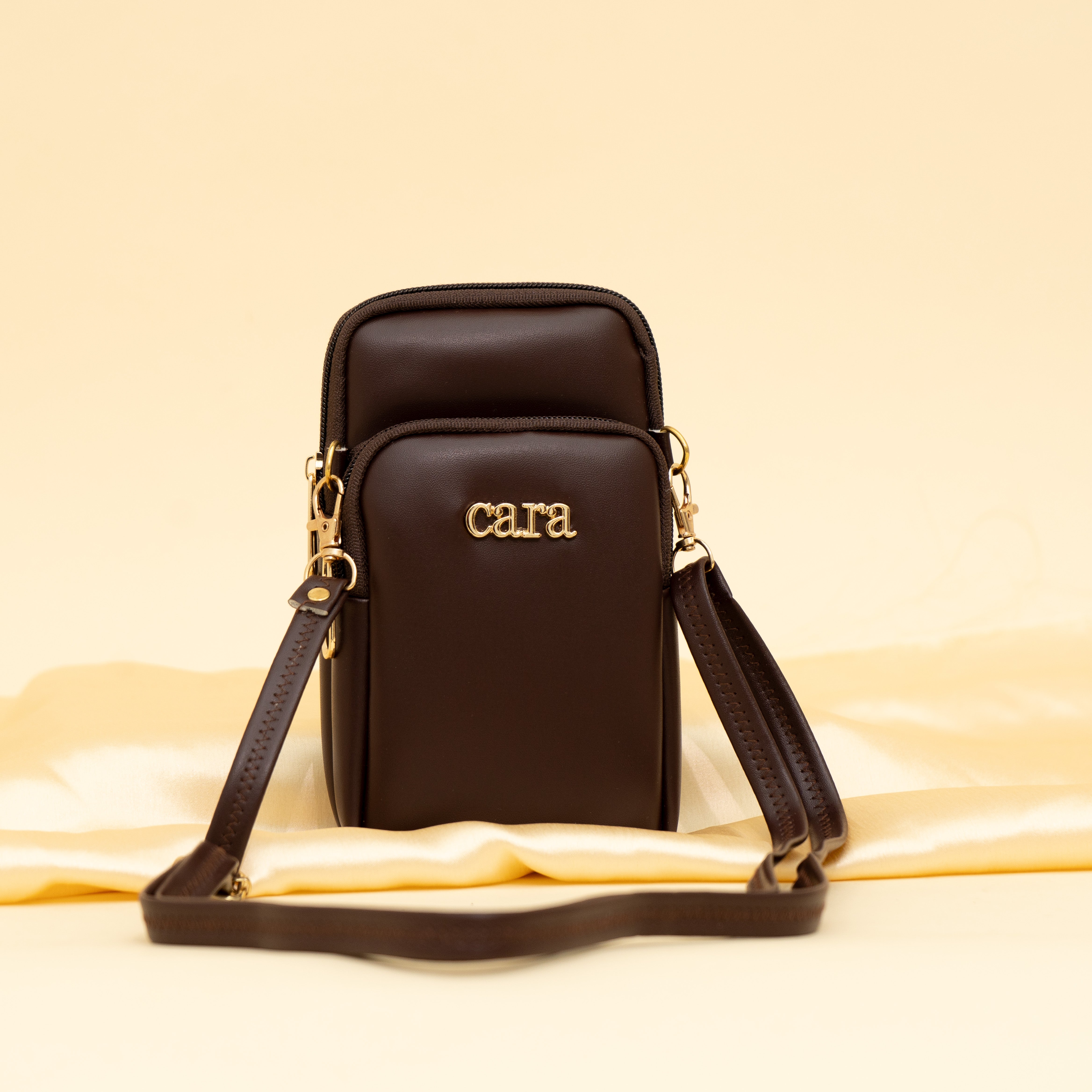 brown Daily Drip mobile sling| cara