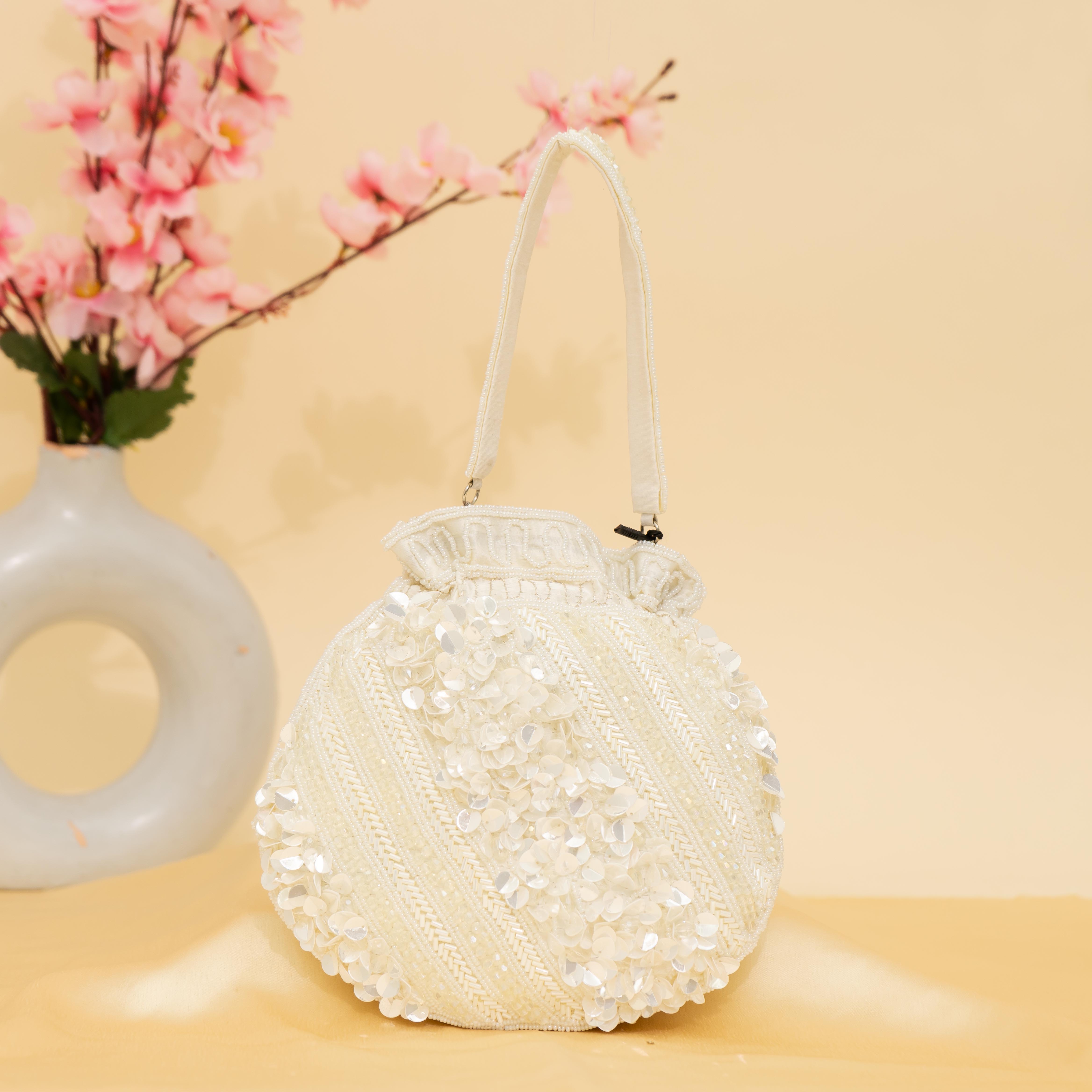 white Celestial Oyster potli | cara