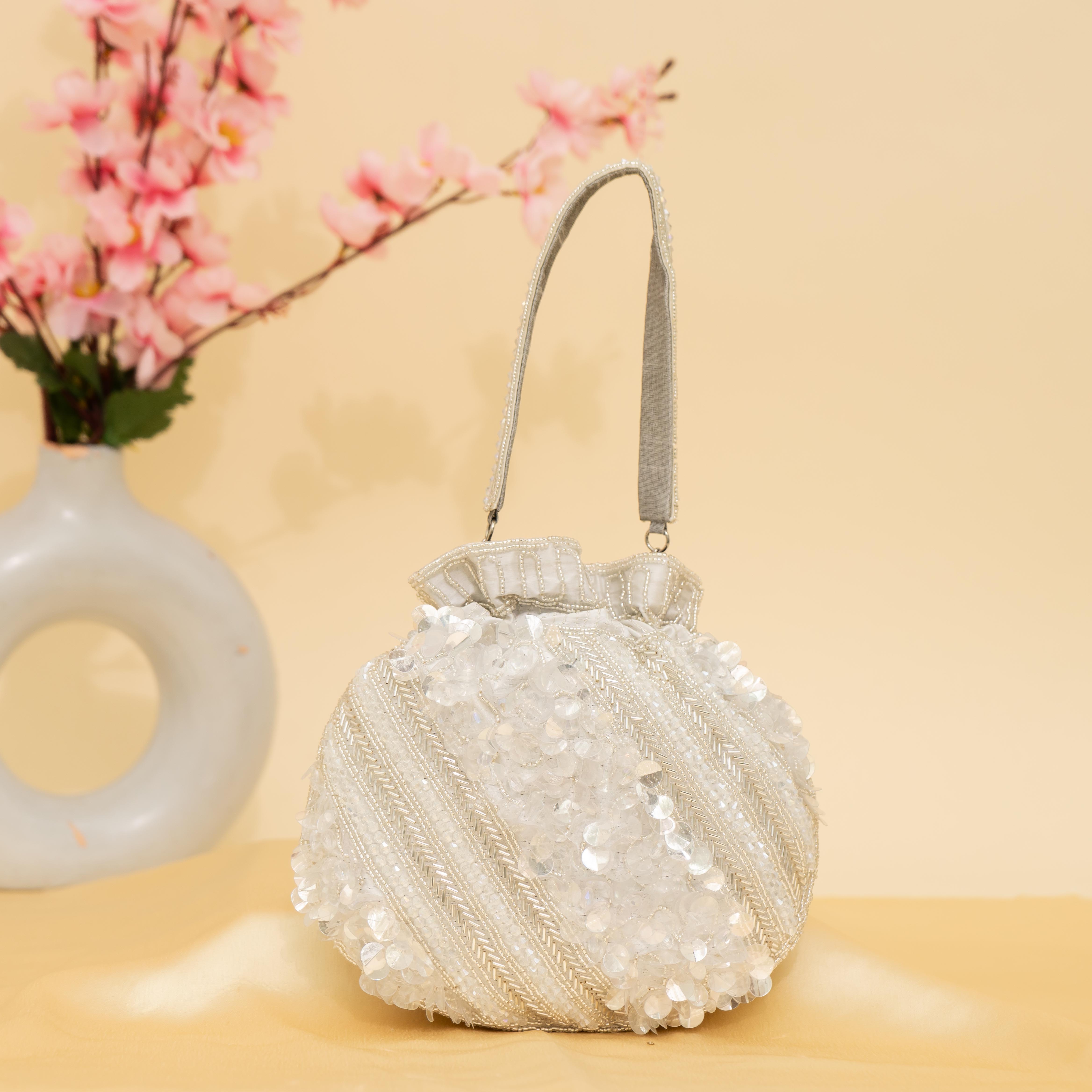 silver Celestial Oyster potli | cara