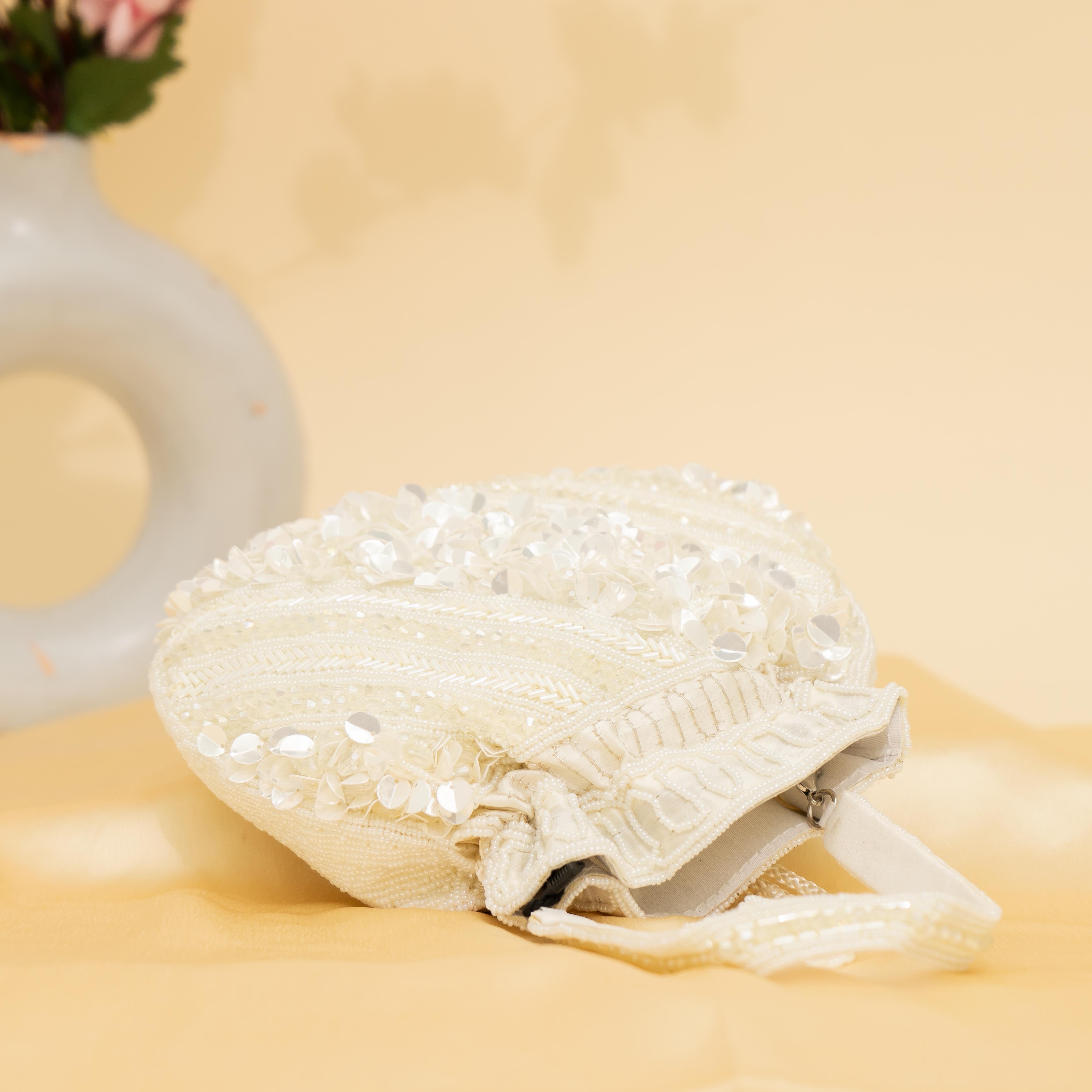 white Celestial Oyster potli | cara