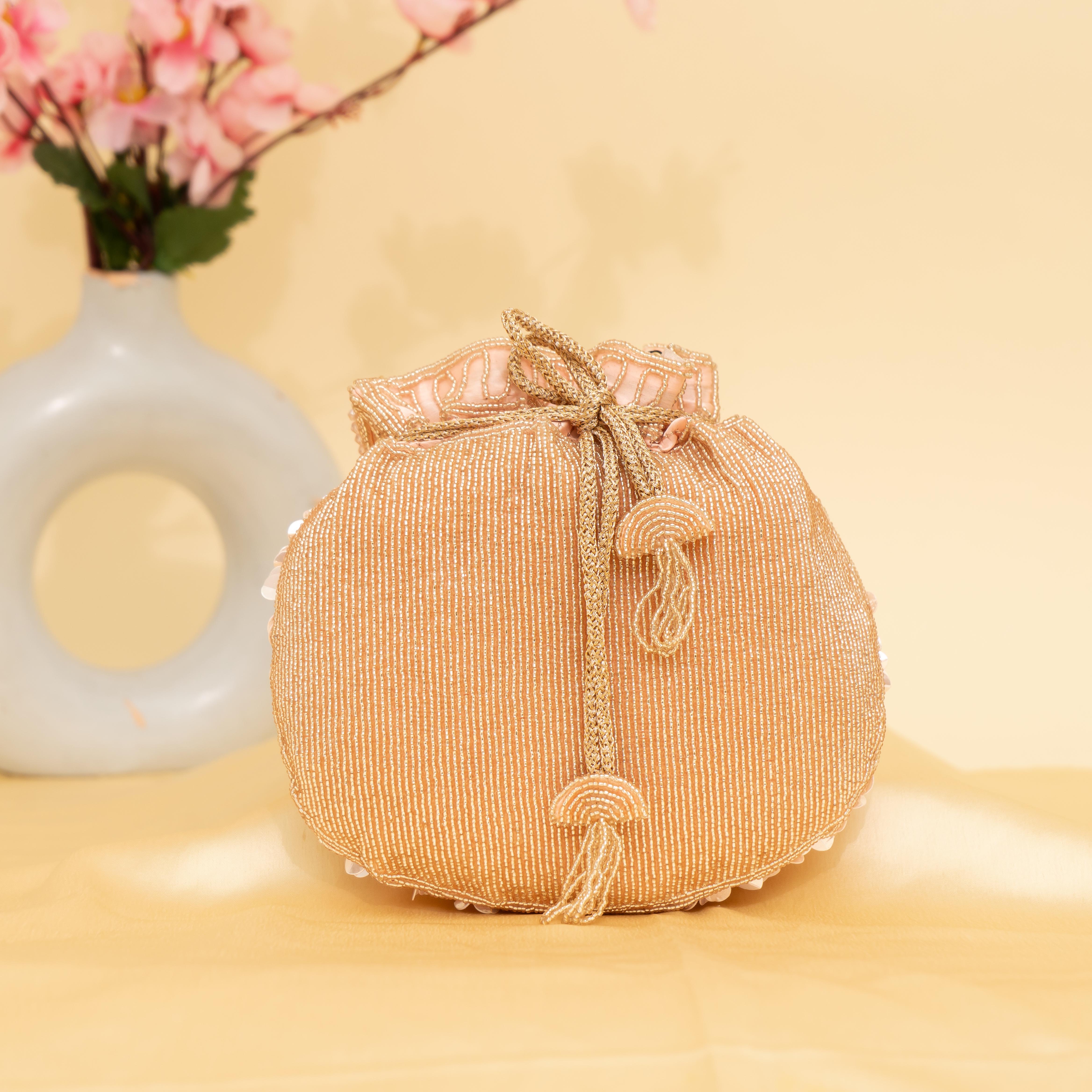 peach Celestial Oyster potli | cara