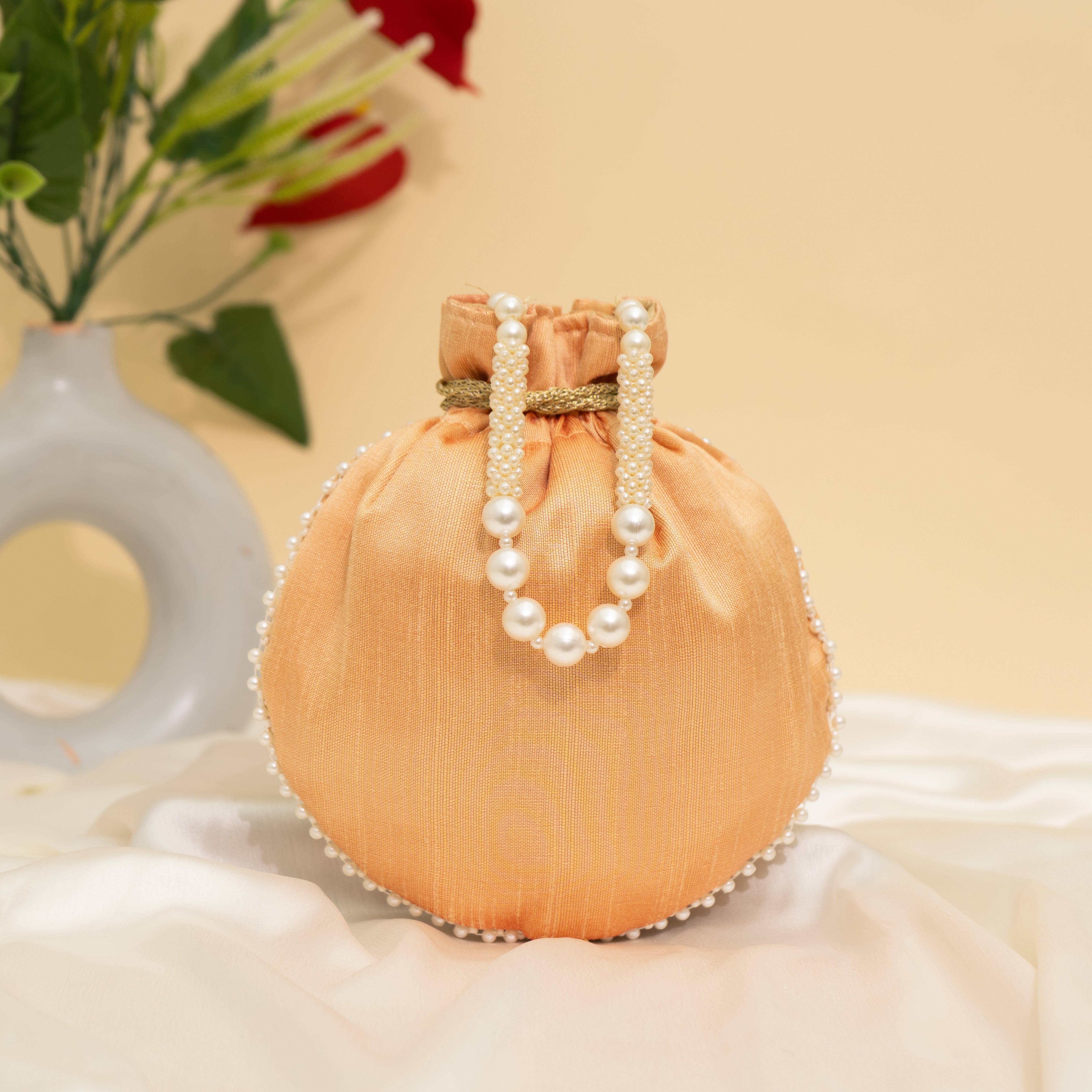 Light Orange Pearl Glow Fantasy Potli