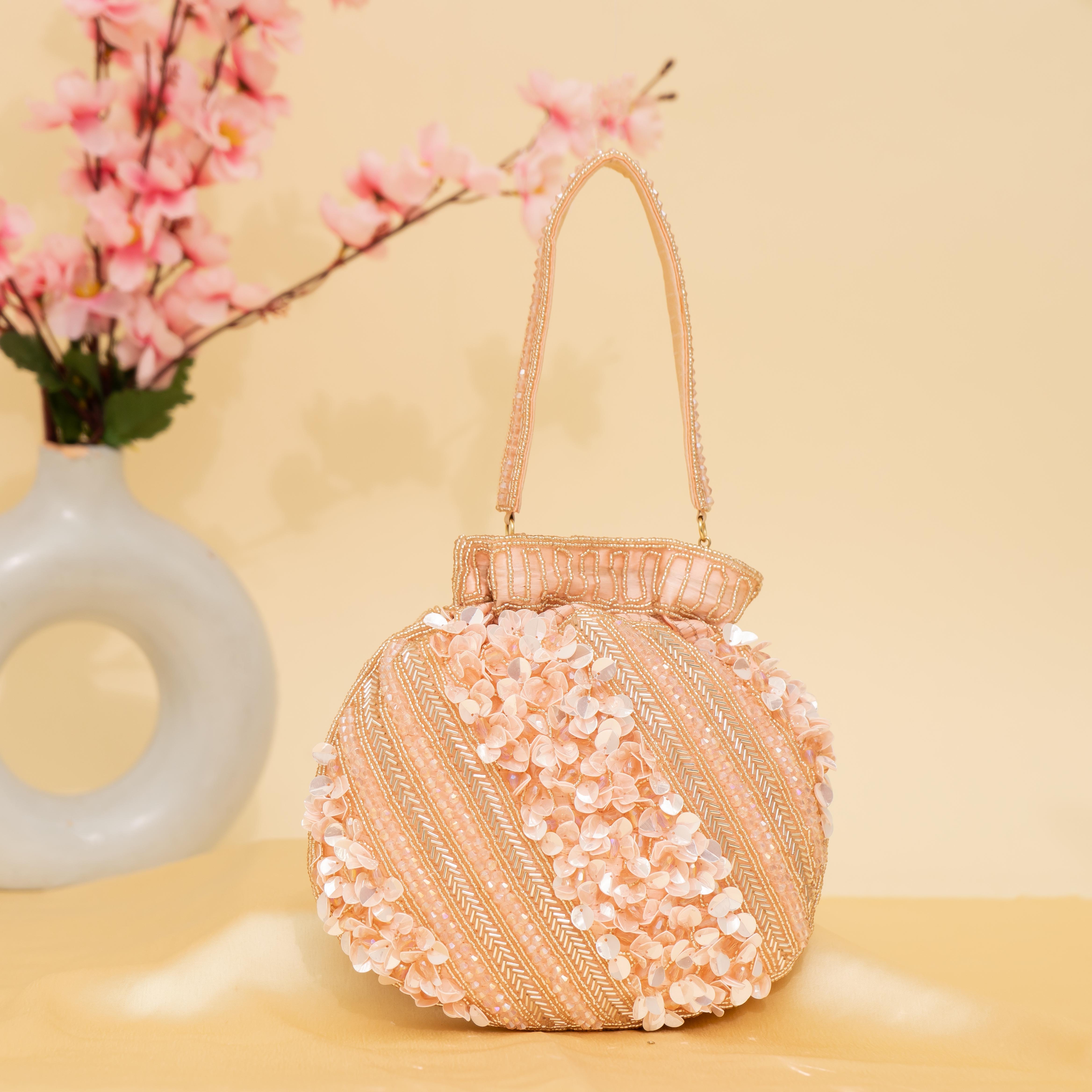 peach Celestial Oyster potli | cara