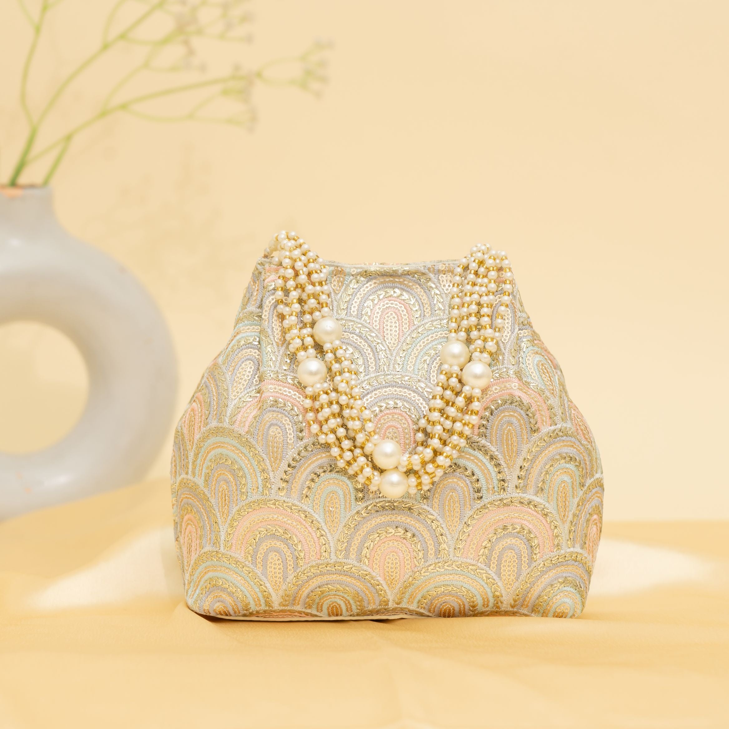 Golden Grace Potli-cream | cara