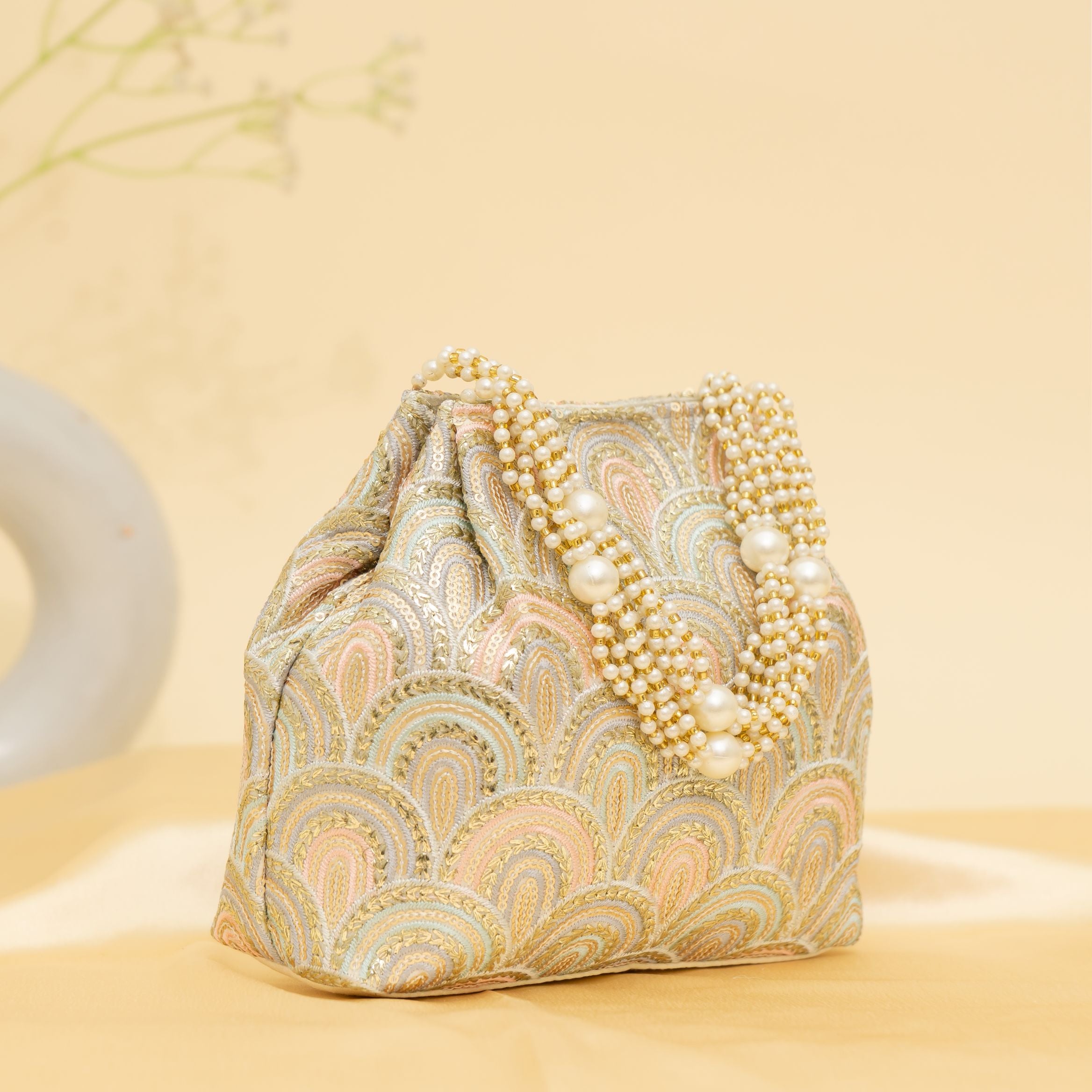 Golden Grace Potli-cream | cara