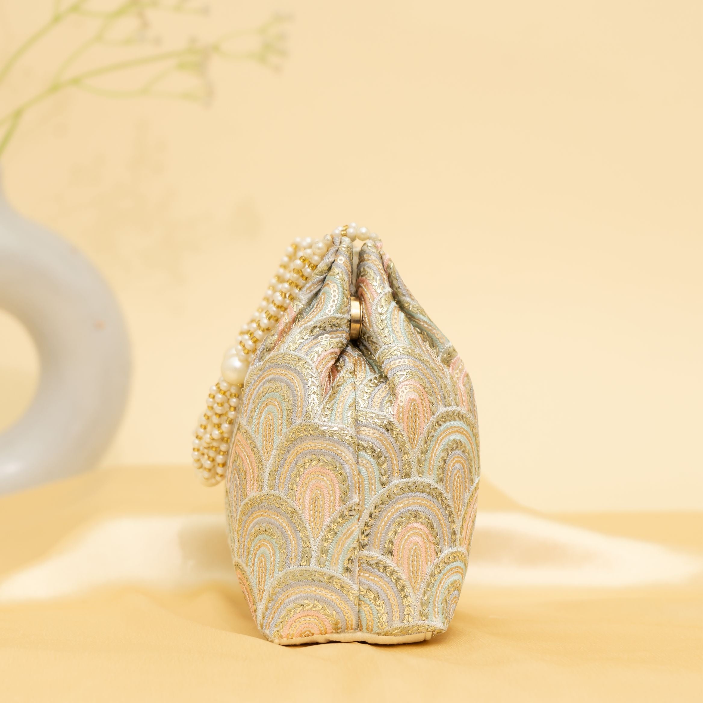 Golden Grace Potli-cream | cara