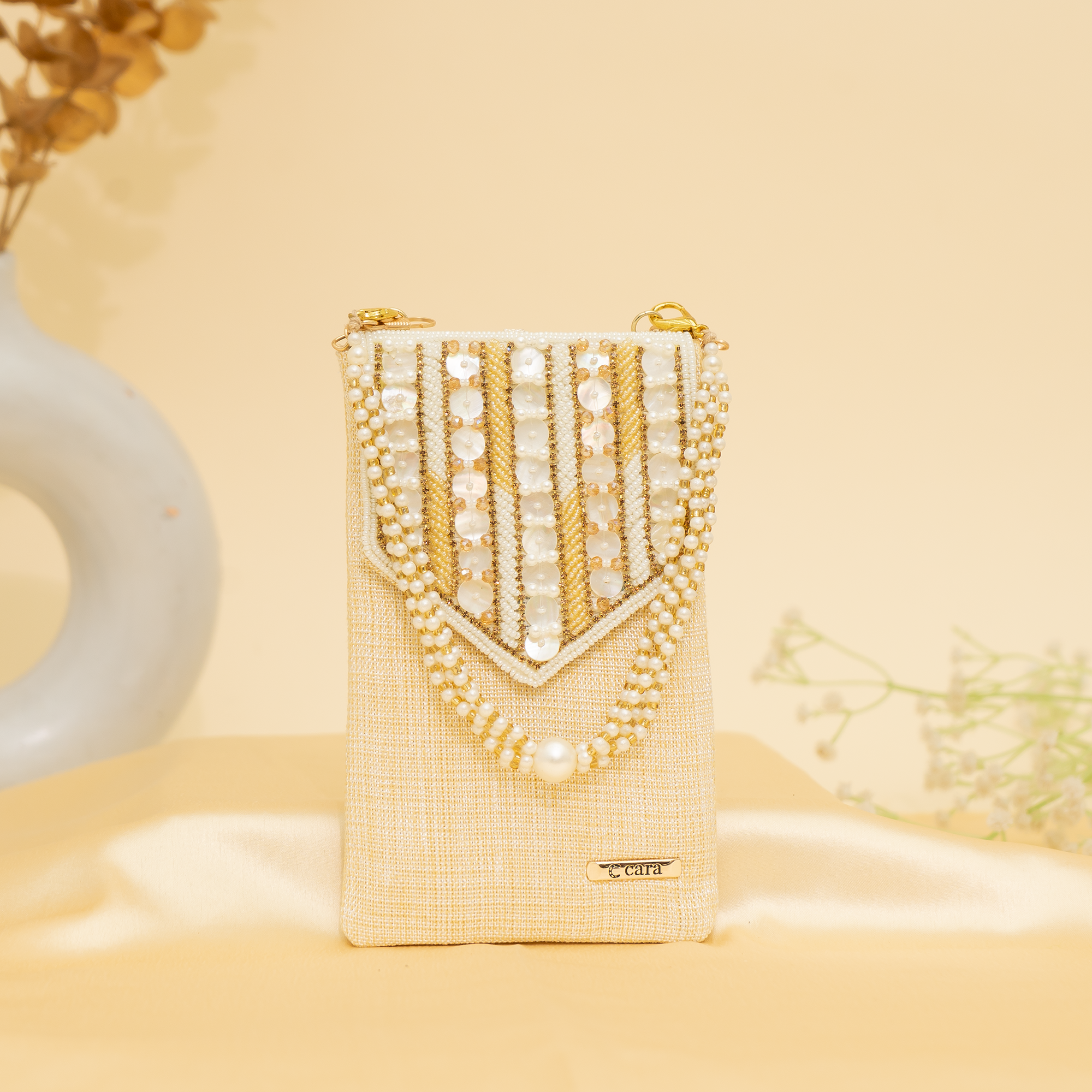 cream Lustrous Charm Designer Mobile sling | cara