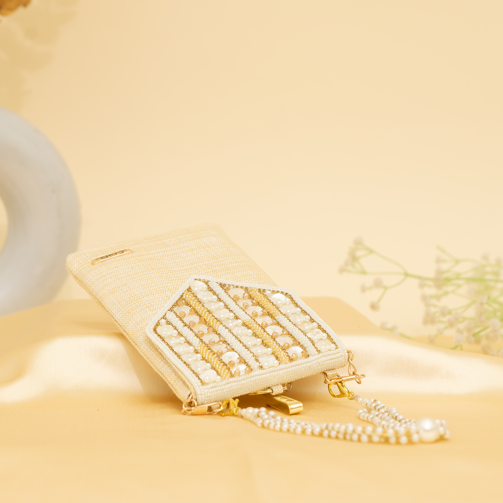 cream Lustrous Charm Designer Mobile sling | cara