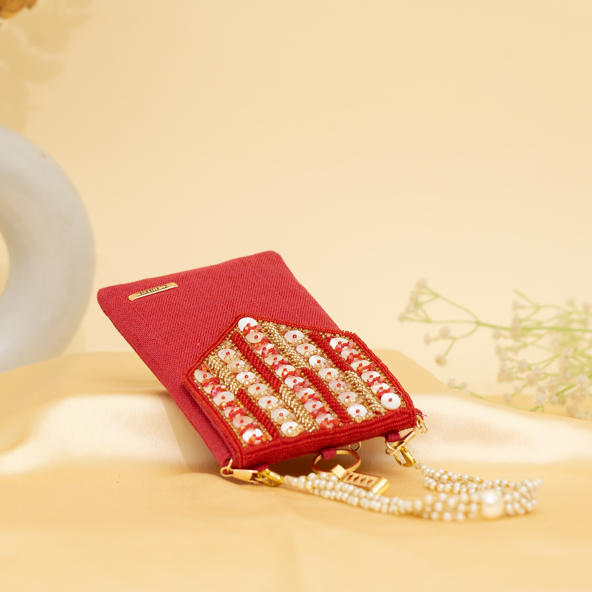 red Lustrous Charm Designer Mobile sling | cara