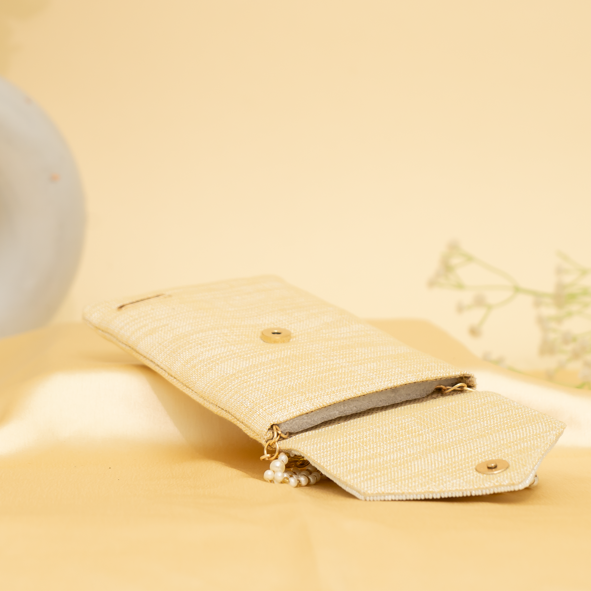 cream Lustrous Charm Designer Mobile sling | cara