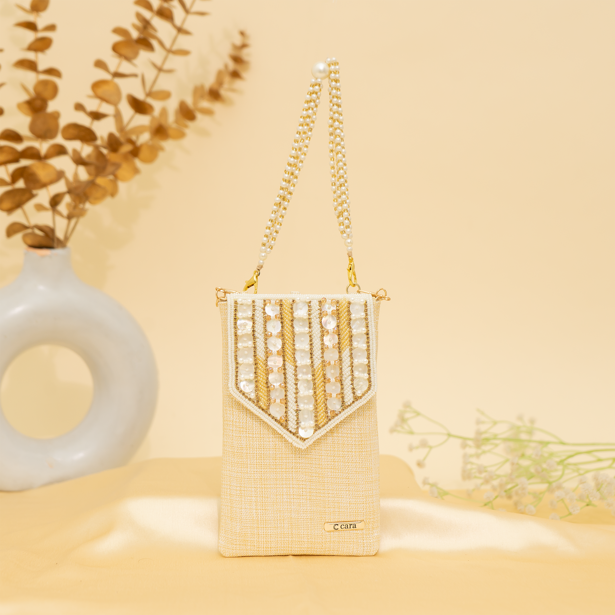 cream Lustrous Charm Designer Mobile sling | cara