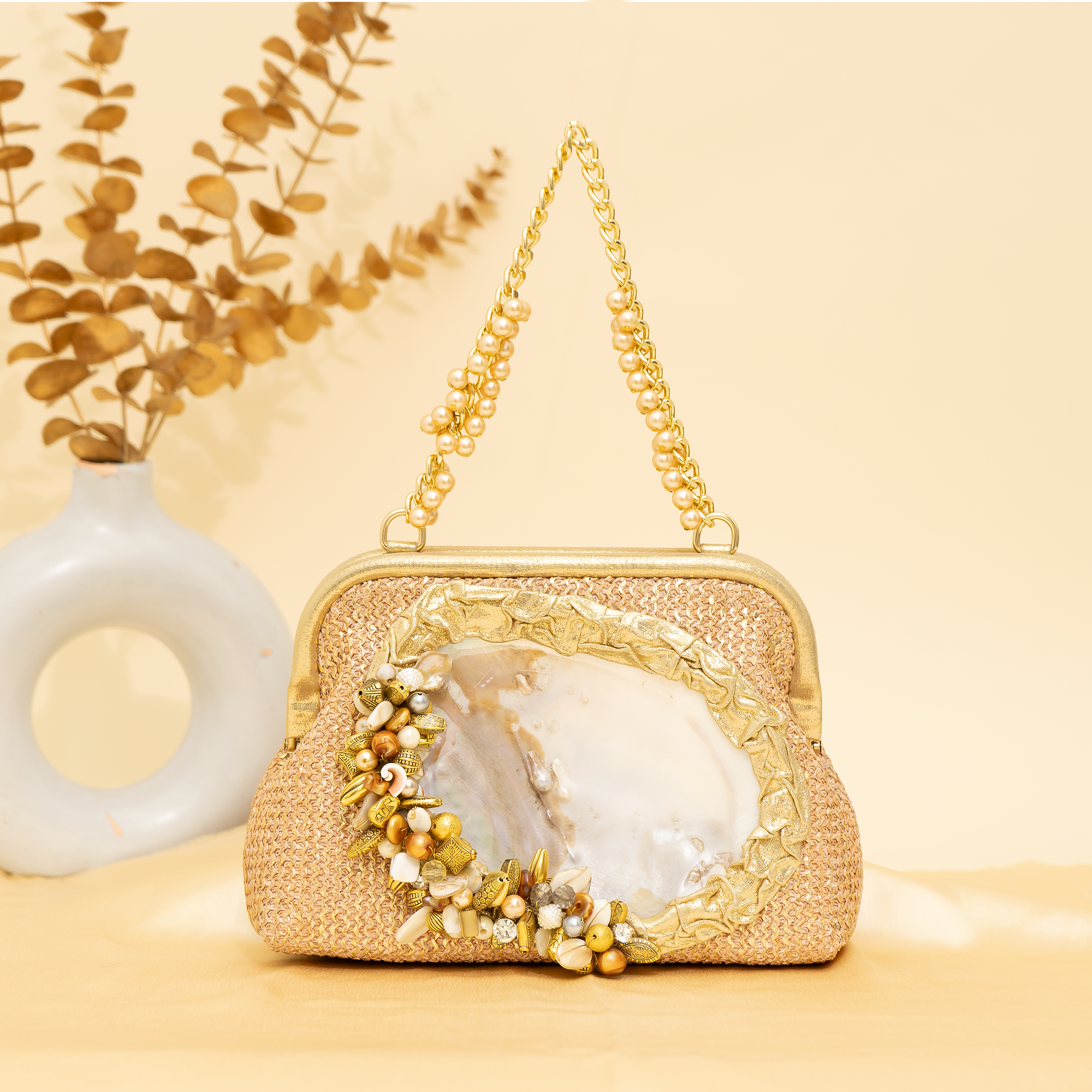 warm gold Empress Shell potli | cara