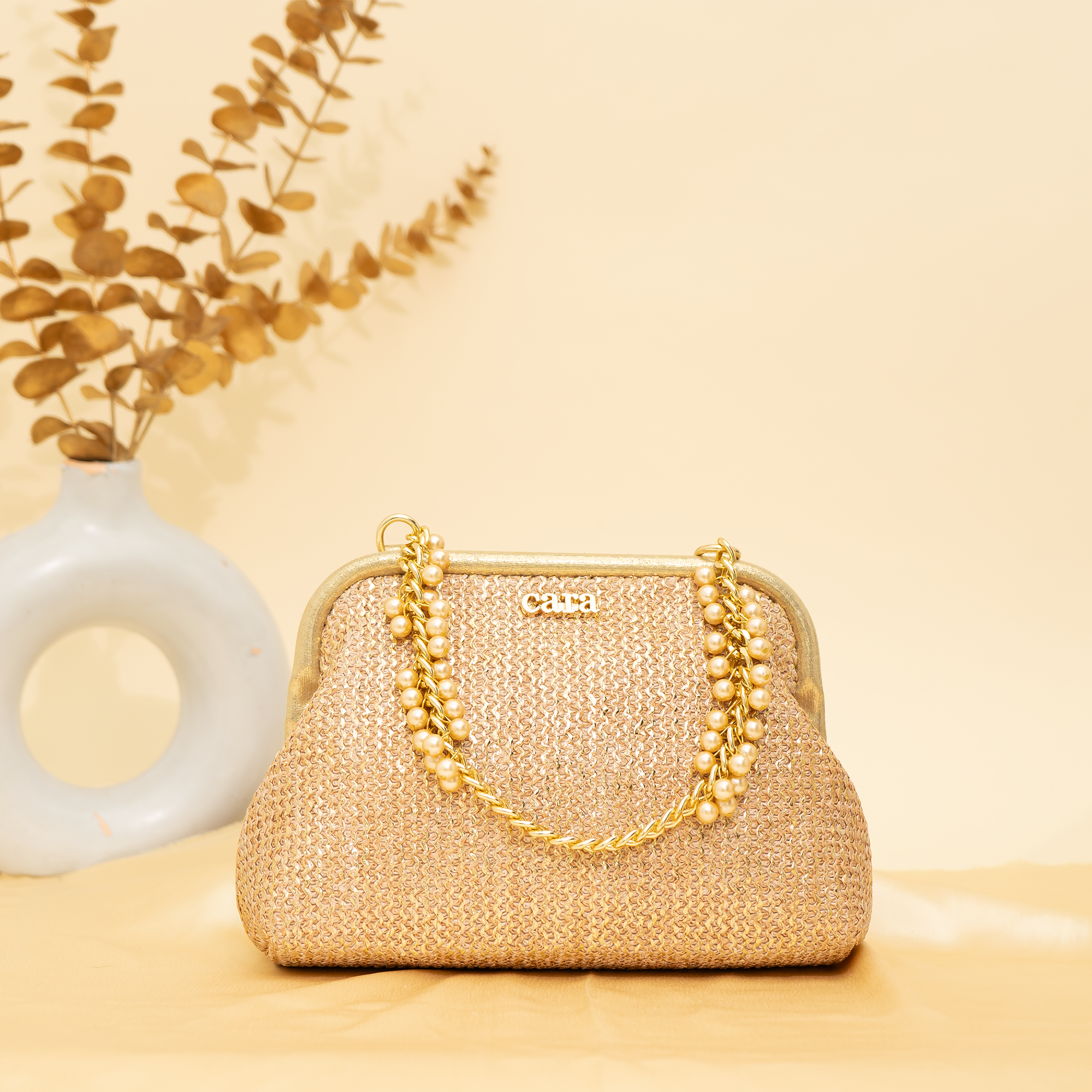 warm gold Empress Shell potli | cara