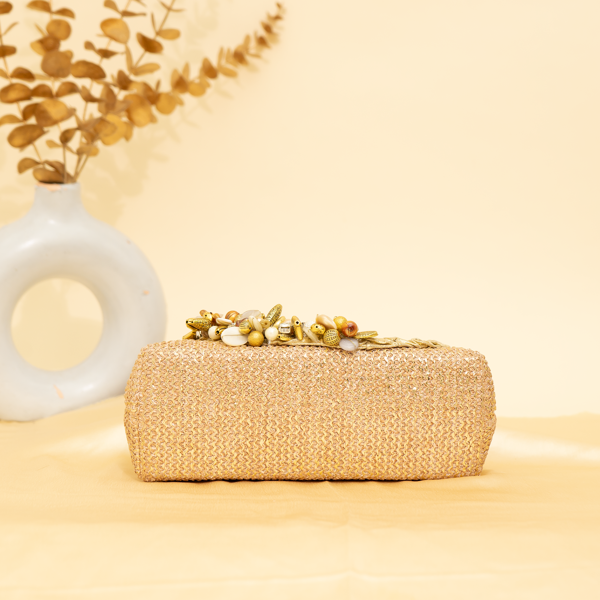 warm gold Empress Shell potli | cara